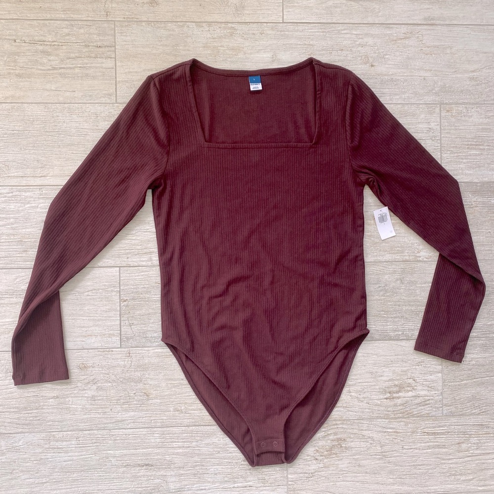 NWT long sleeve body suit size large maroon in color